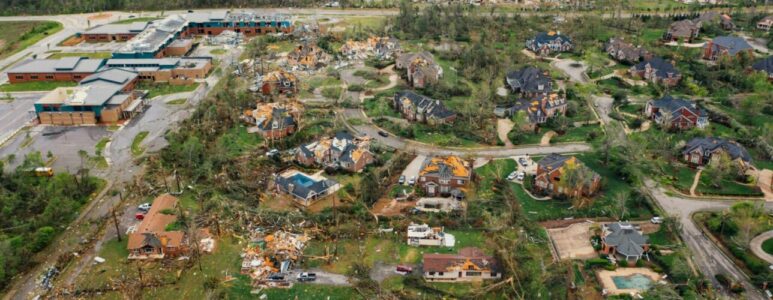 Aerial view of tornado damage to town.