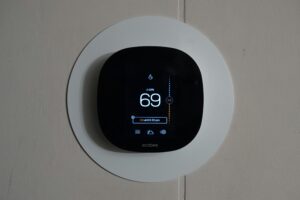 electronic thermostat on wall
