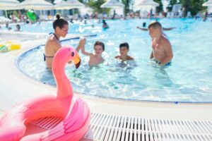family in community pool