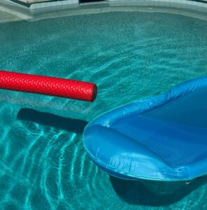 floatation devices floating in pool