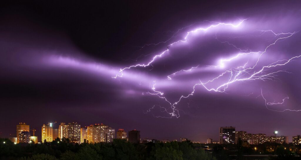 Purple lightning over city